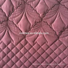 Winter fashion womenswear coat fabric with quilting and embroidery